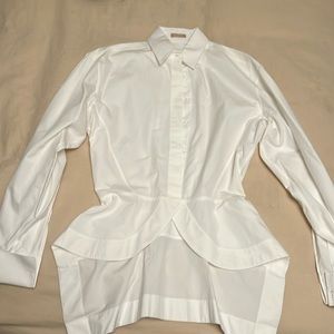Alaia white blouse with back detail and cinched waist.
